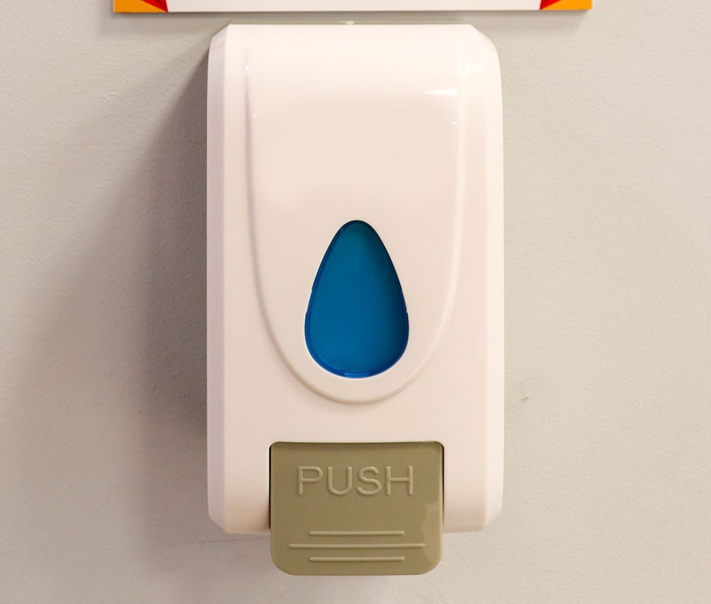hand sanitizer dispenser in hotels